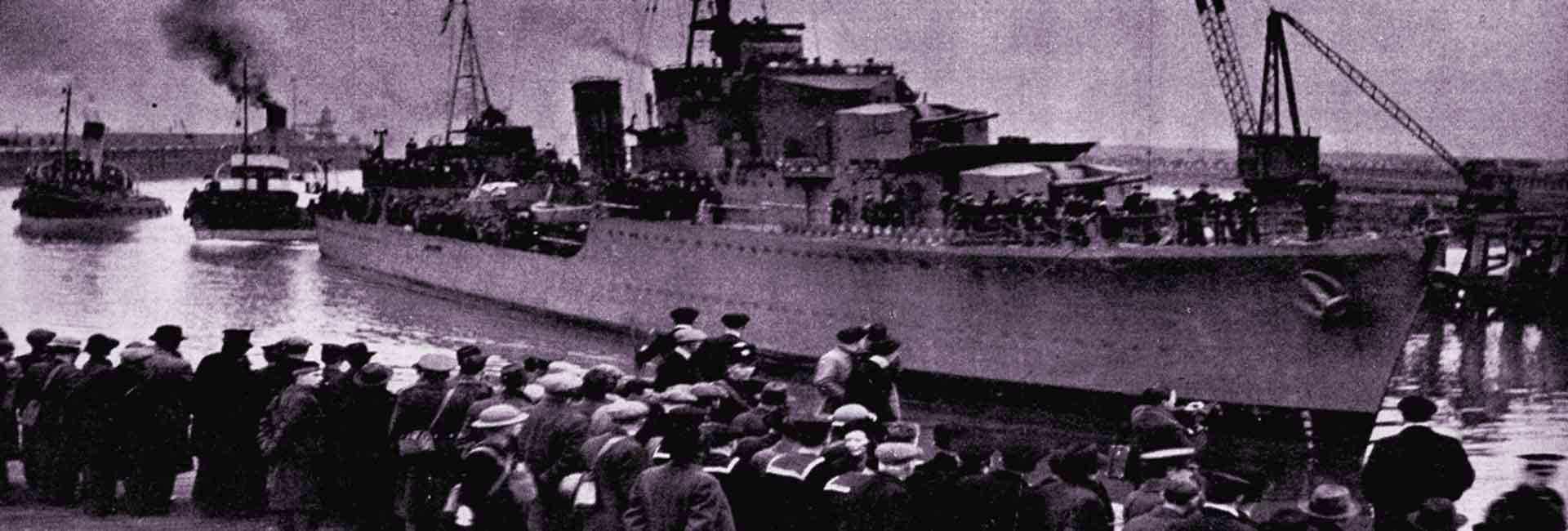 HMS Cossack arrives in Leith, greeted by onlookers